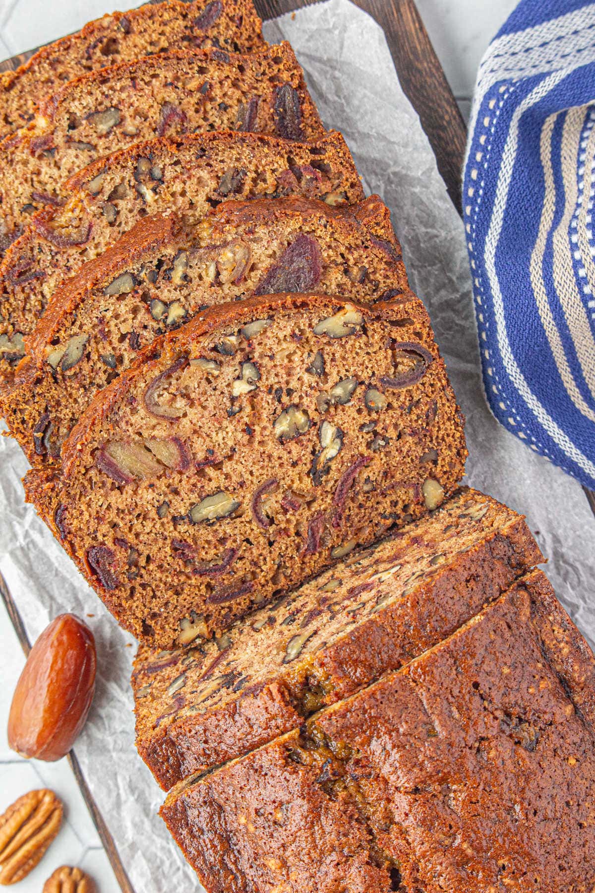 An overhead view of sliced date nut bread.