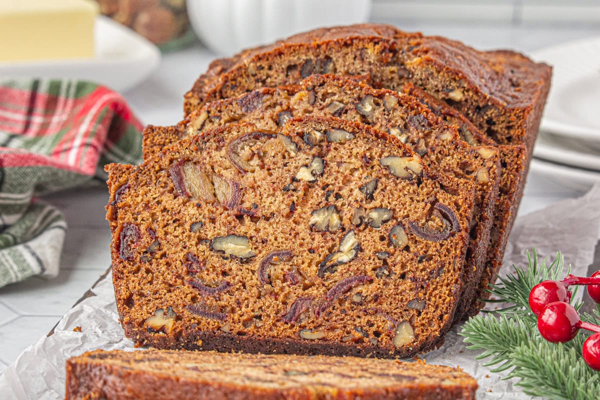 A loaf of Date Nut Bread sliced.