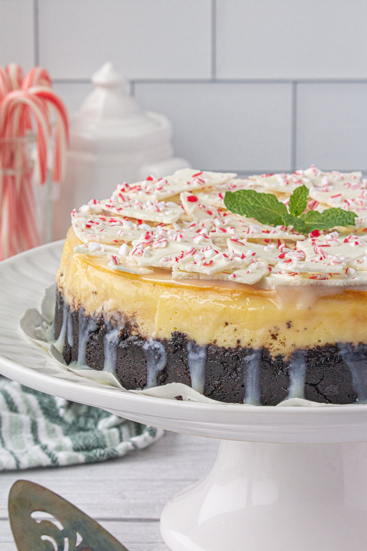 Peppermint bark cheesecake ready to be cut.