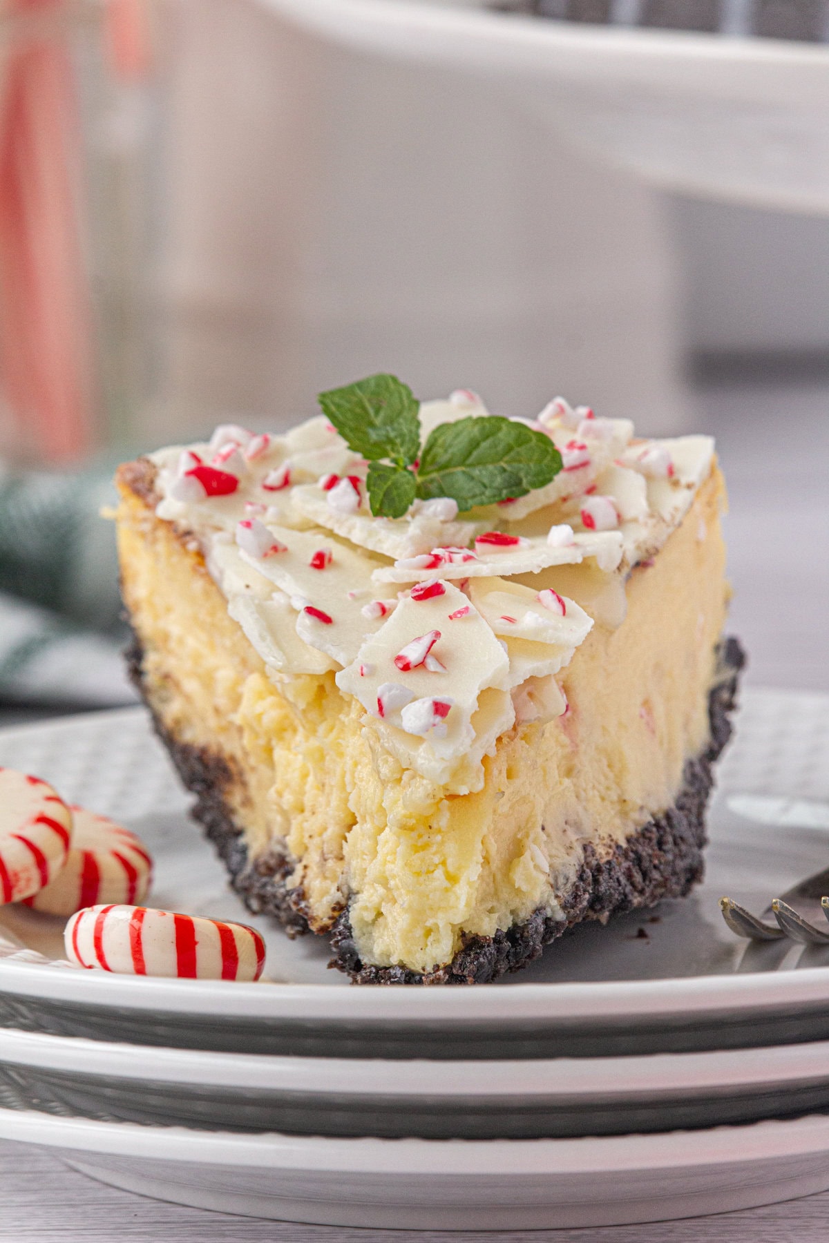 Slice of peppermint bark cheesecake on a plate.