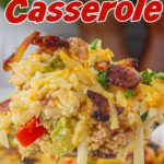 A spoonful of Amish Breakfast Casserole being spooned up with a title text overlay for Pinterest.