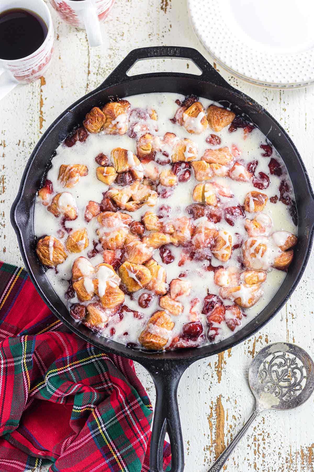 Cherry cream cheese bubble up in a skillet.