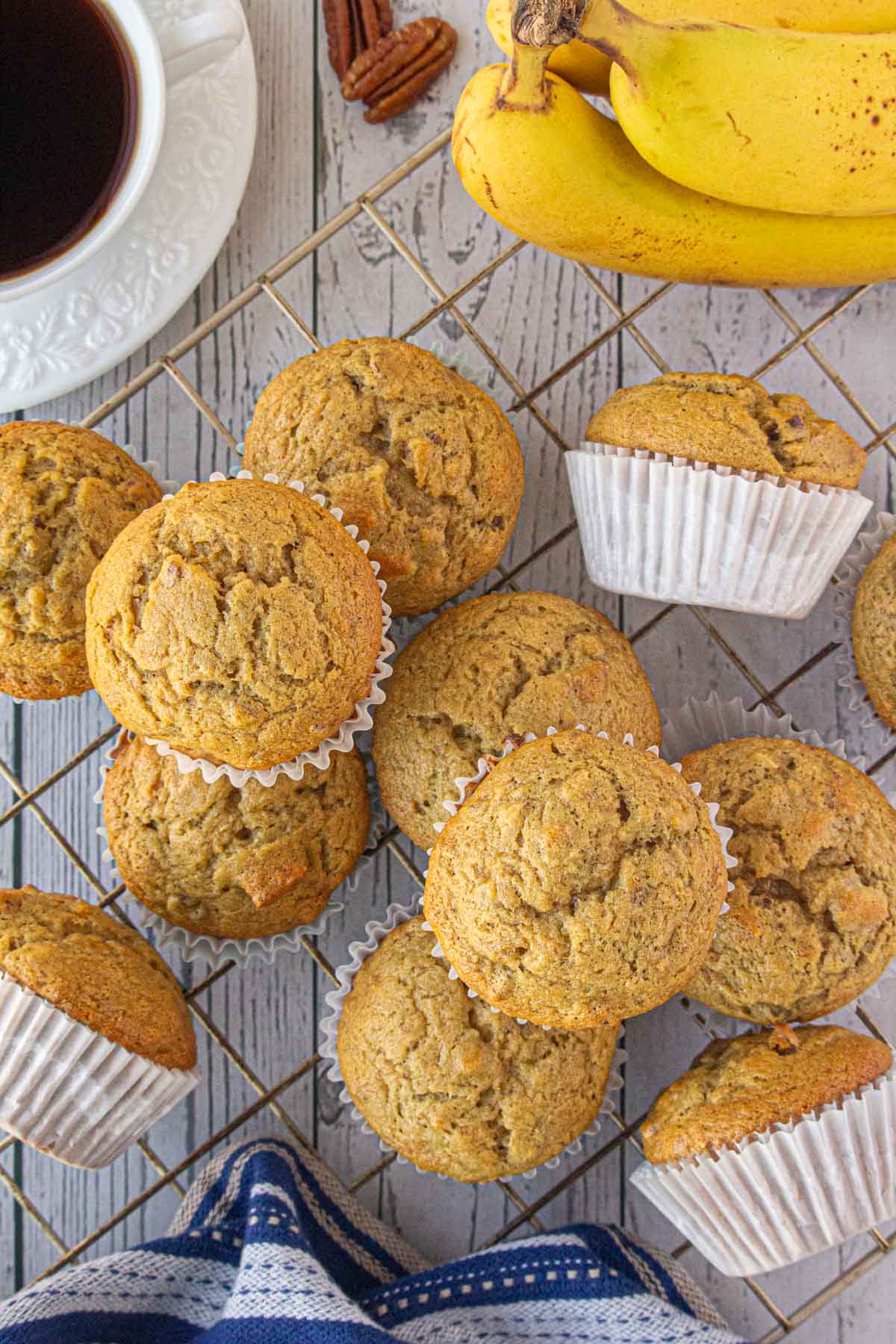 An overhead view of brown butter banana pecan muffins on a cooling rack.