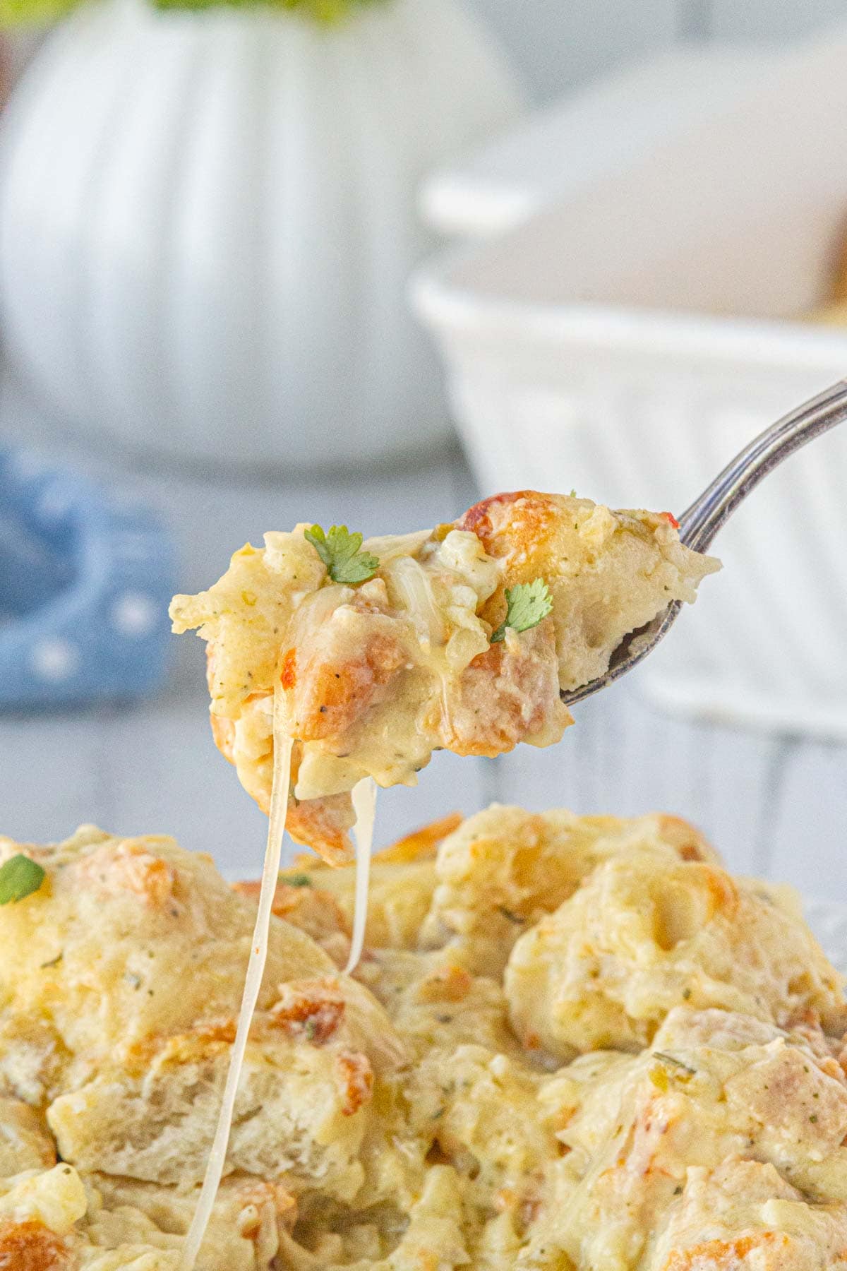 A close-up view of chile chicken bubble up bake on a fork.