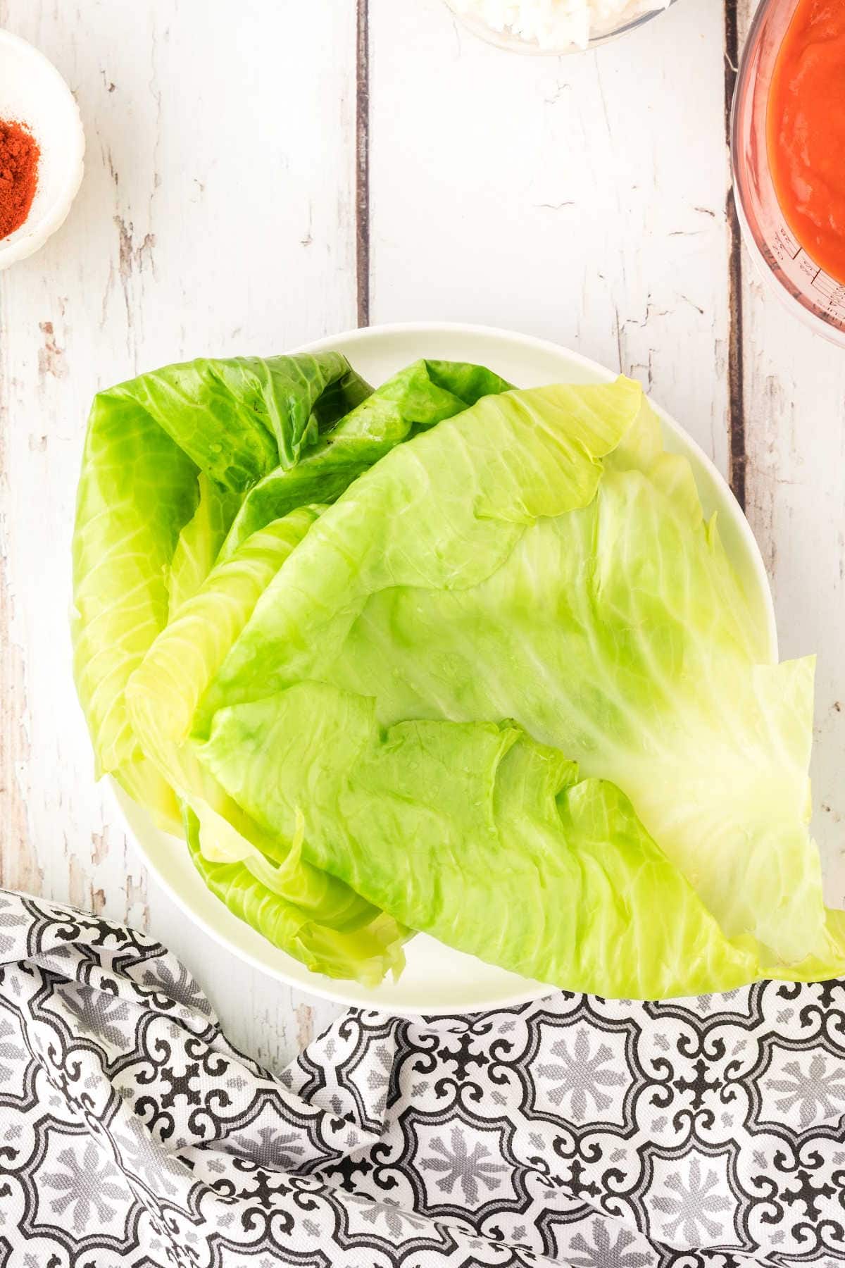 Steamed cabbage leaves on a plate.