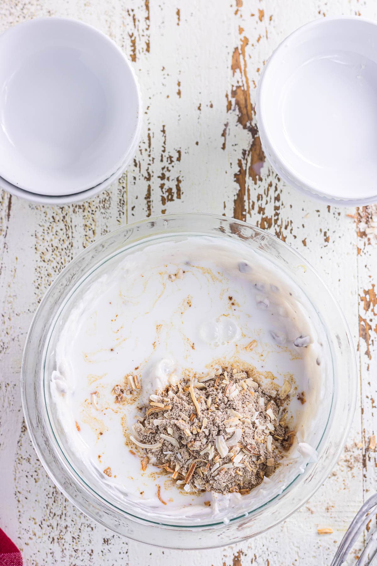 Combining the onion soup mix and milk with the cream of mushroom soup and cream cheese.