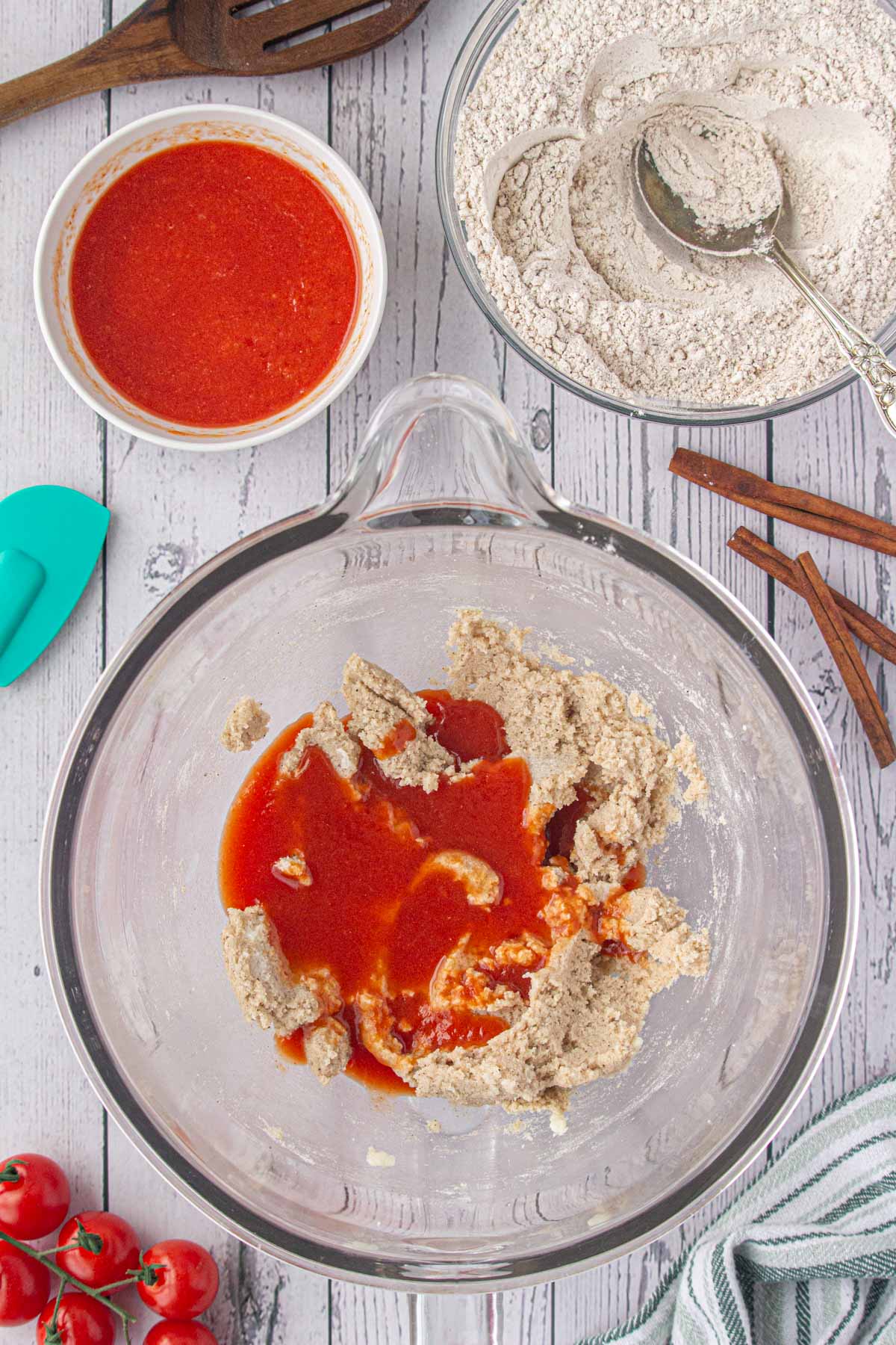 Adding some tomato juice to the batter.