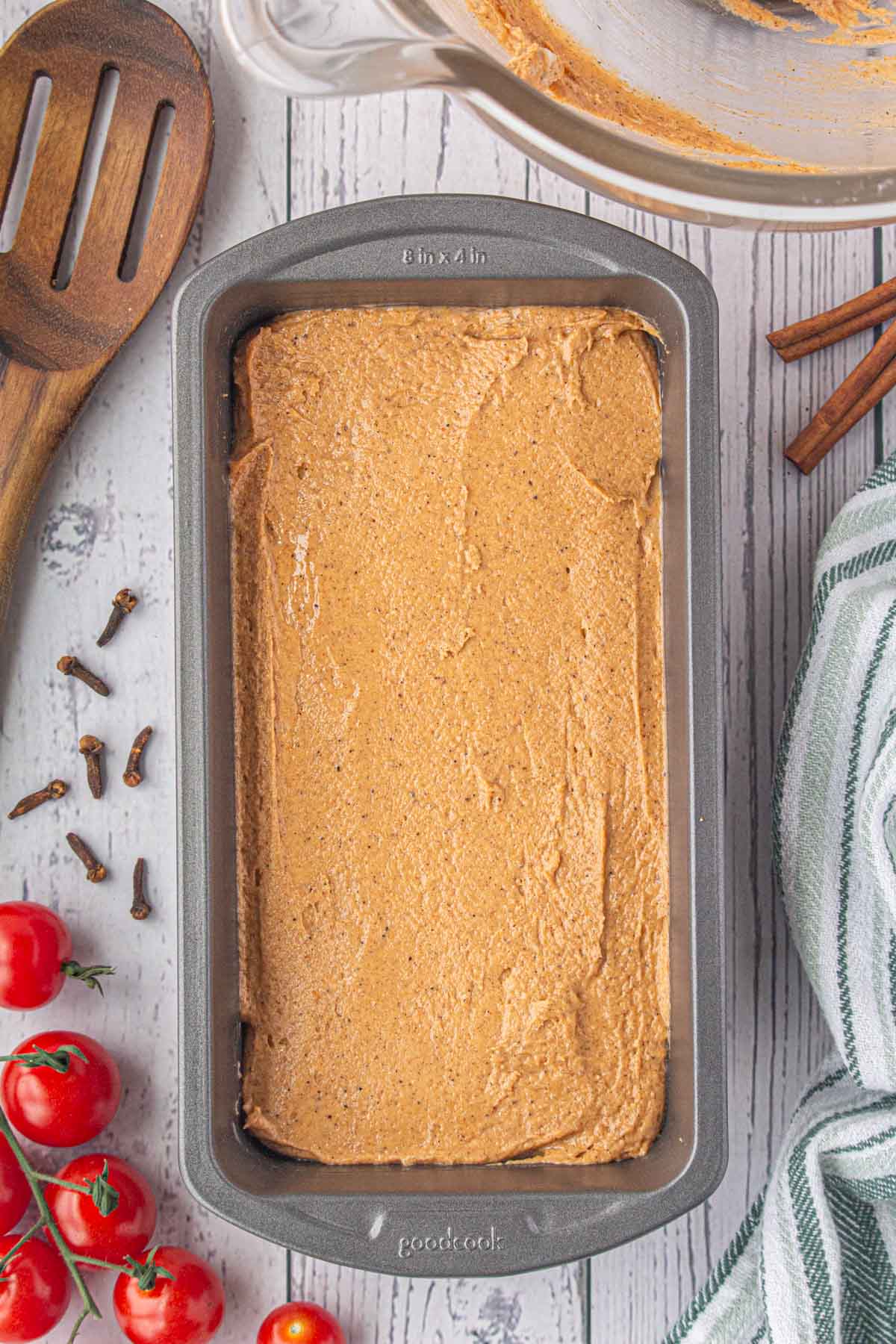 The tomato cake batter spread in a loaf pan.