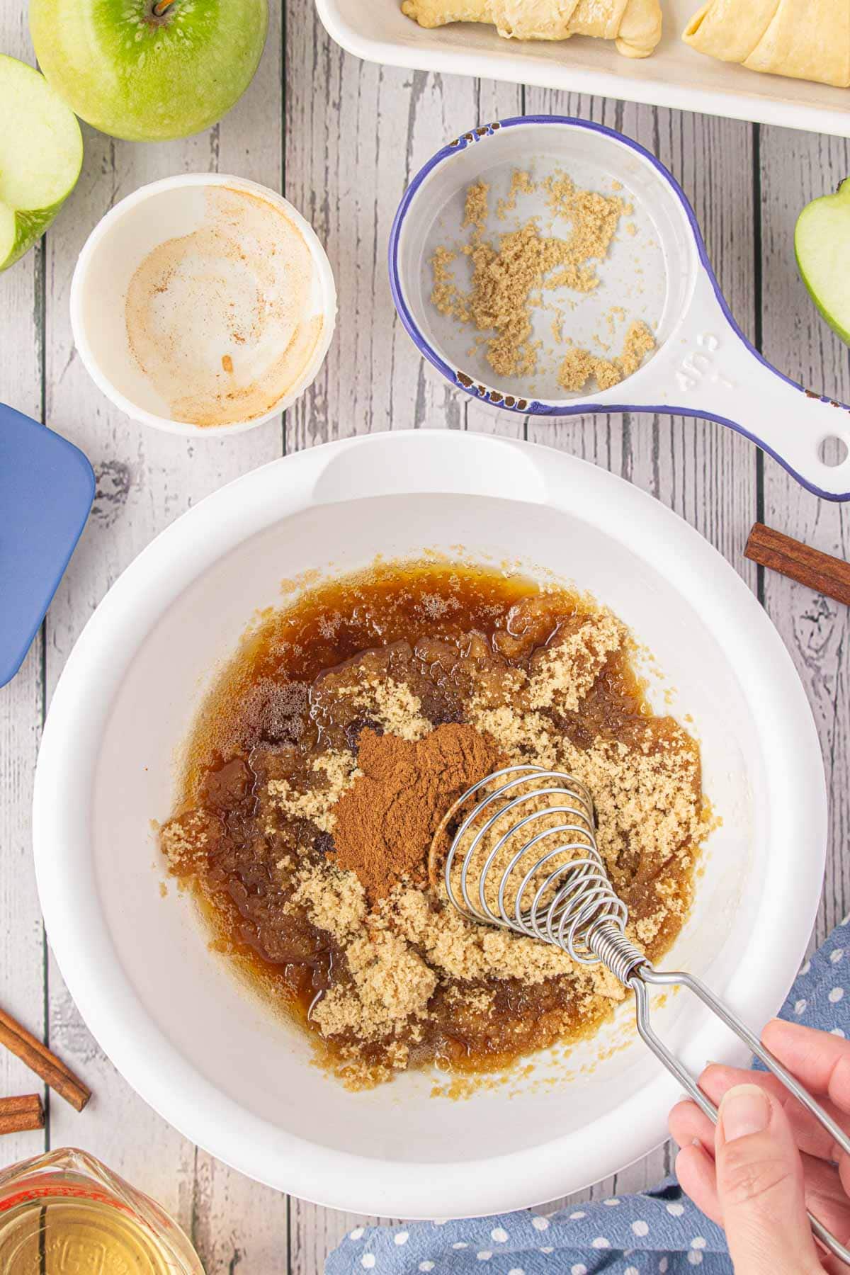 Whisking the brown butter, sugar, and cinnamon together, 