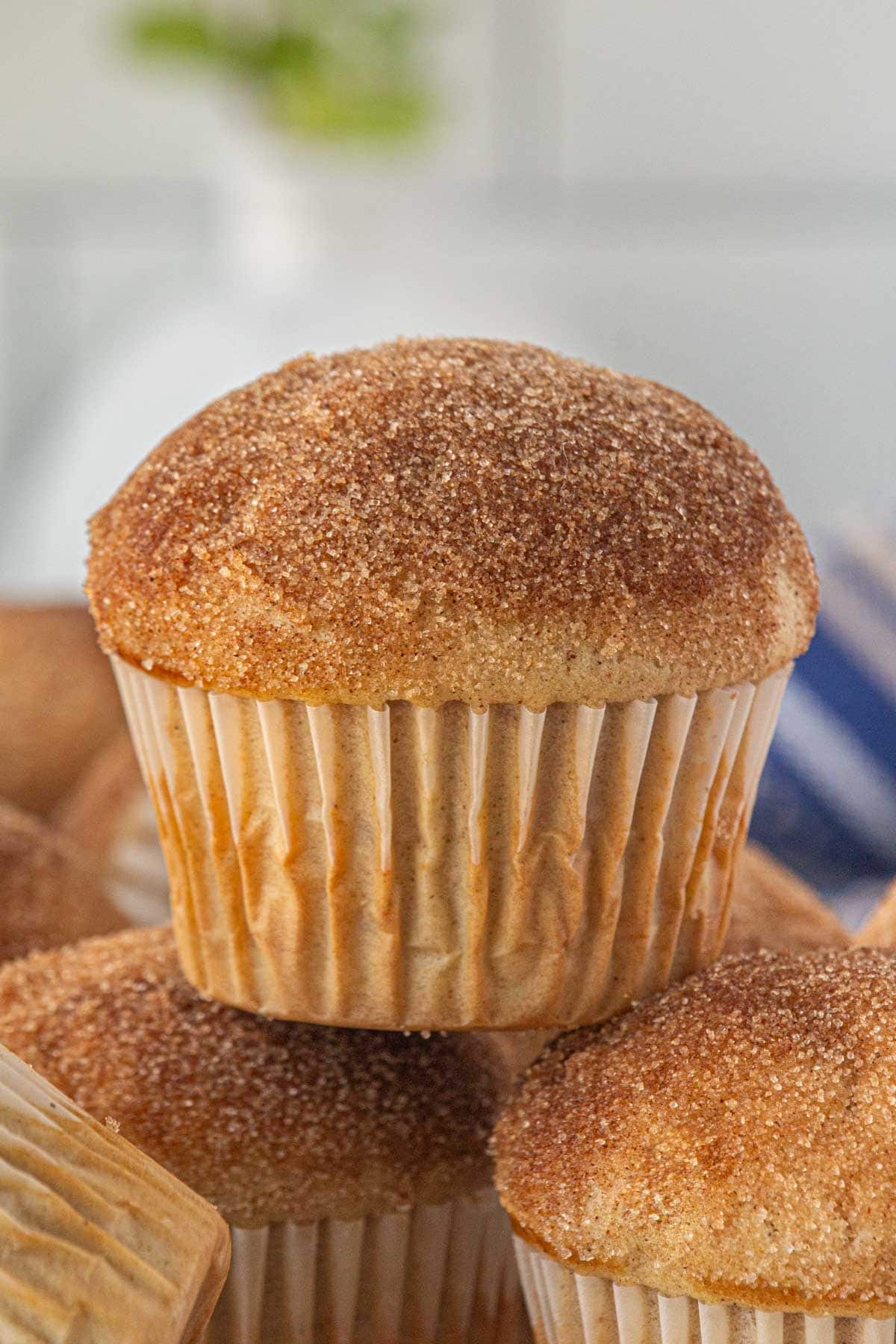 A close-up view of French breakfast puffs stacked on top of each other.