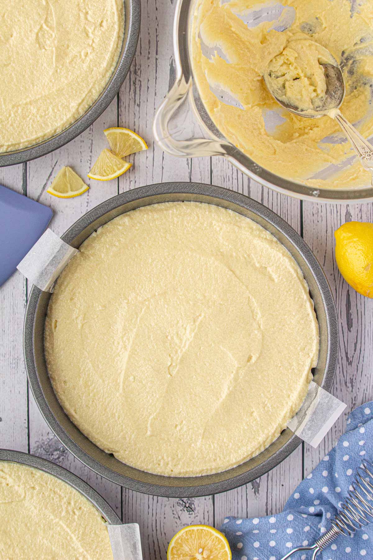 Moist lemon cake poured into a lined cake pan.