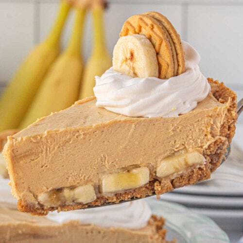 A slice of peanut butter banana icebox pie showing the layers of banana and peanut butter filling.