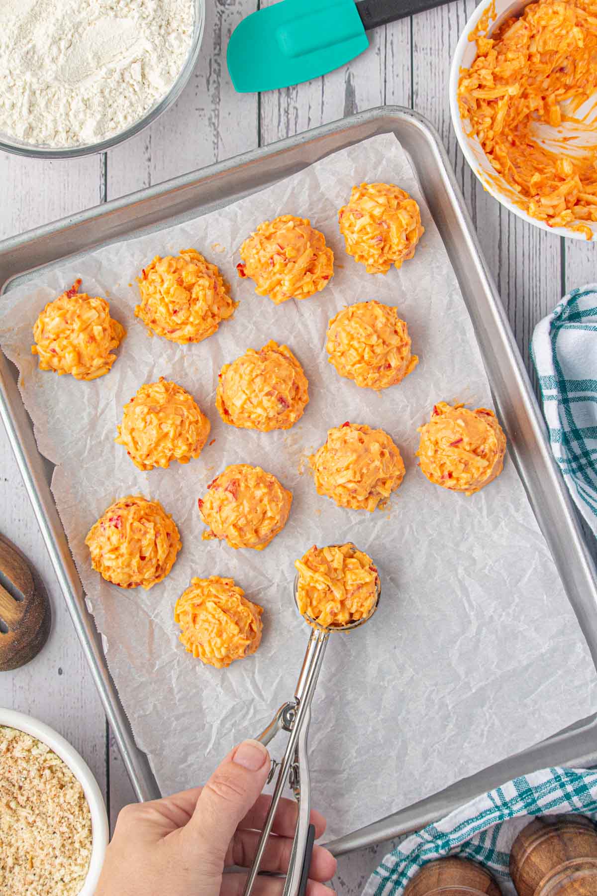 Rolling the pimento cheese into small balls.