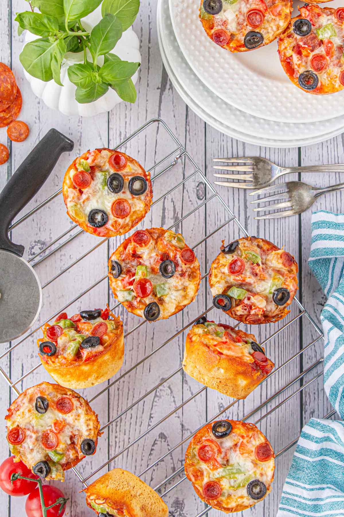 An overhead view of easy pizza cups on a cooling rack.